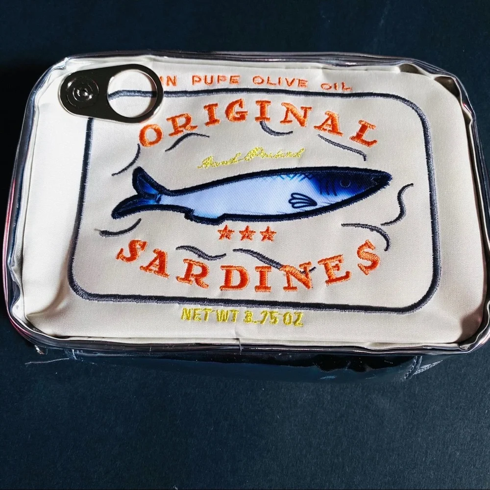 Campy and cute Sardine Can clutch cream & silver zip closure